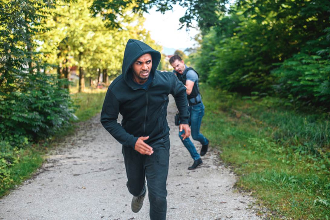 A person running on a path with another person running
AI-generated content may be incorrect.
